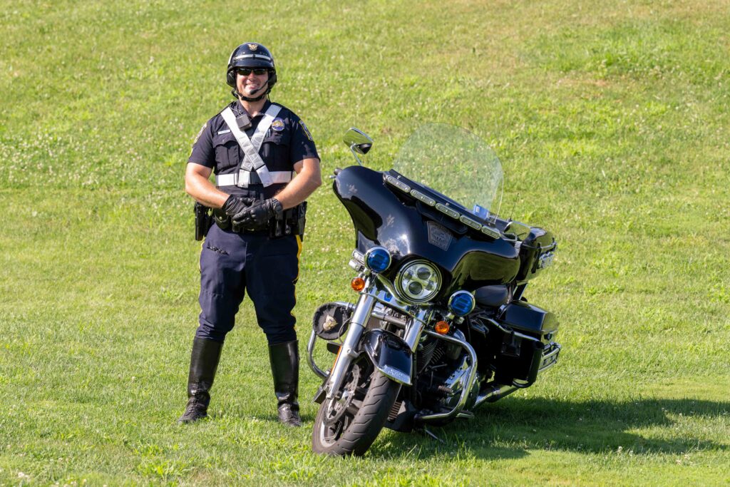 Male police officer with a Motorcycle.